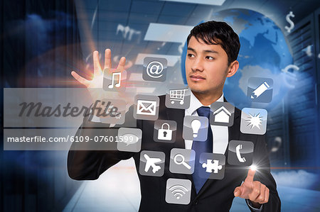 Asian businessman touching app interface Asian businessman touching app interface