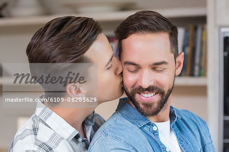 Handsome man embracing his boyfriend