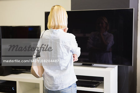 Pretty blonde shopping for new television