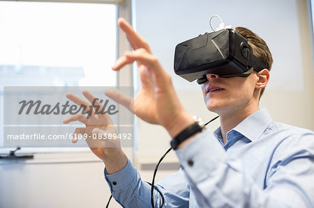 Businessman using oculus rift headset
