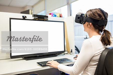 Businesswoman using oculus rift headset