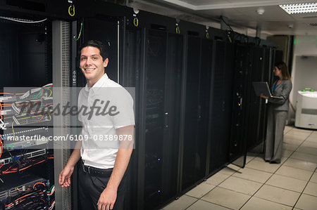 Team of technicians working on servers Team of technicians working on servers