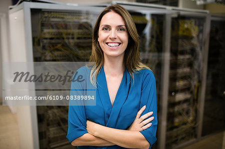 Confident technician smiling at camera