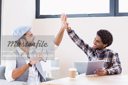 Happy gay couple giving five