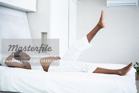 Pregnant woman lying in bed