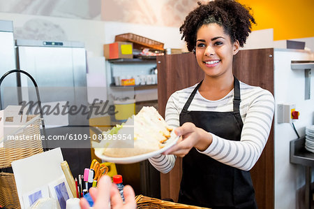 Waitress serving lunch to customer