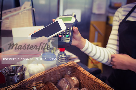 Customer paying with mobile phone