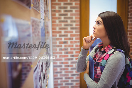 Pretty woman reading notice