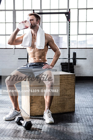 Fit man drinking his protein shake