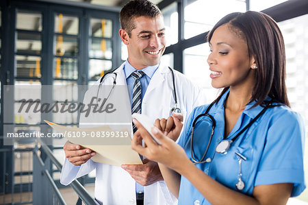 Nurse and doctor looking at a phone