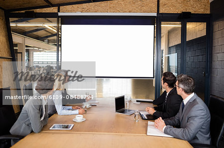 Business team using video chat during meeting at the office