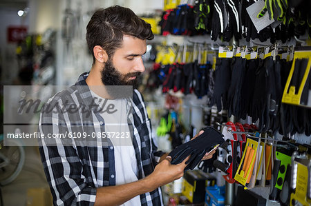 Serious customer picking out gloves