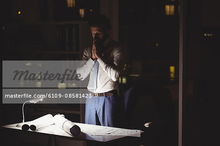 Overworked businessman working at night