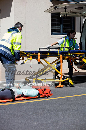 Ambulance men taking care of injured people