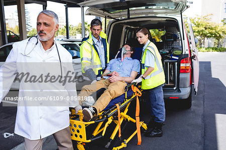 Injured man with ambulance men