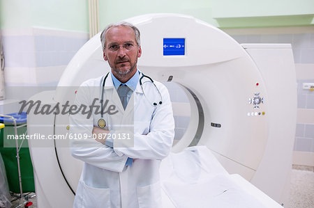 Portrait of doctor standing near mri scanner at the hospital