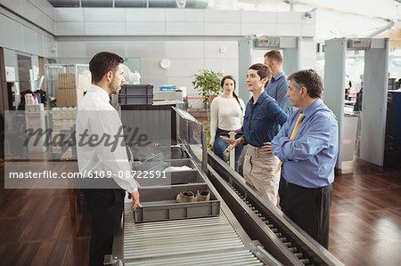 Passengers in airport security check at airport