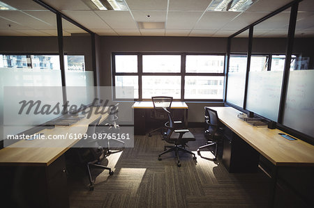 Table and empty chairs in  modern office