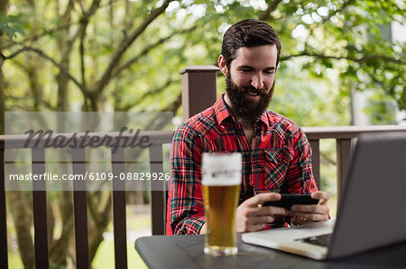 Man using mobile phone in bar