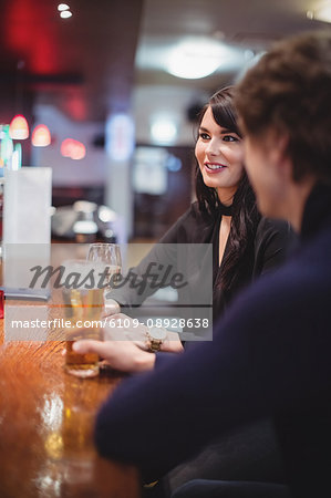 Couple having drinks together in bar