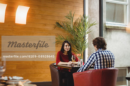 Couple having drinks together in bar