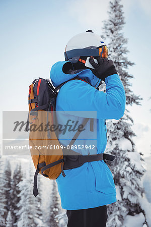 Skier talking on mobile phone