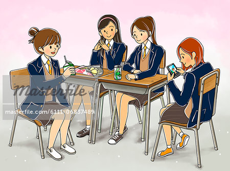 School girls having lunch in canteen