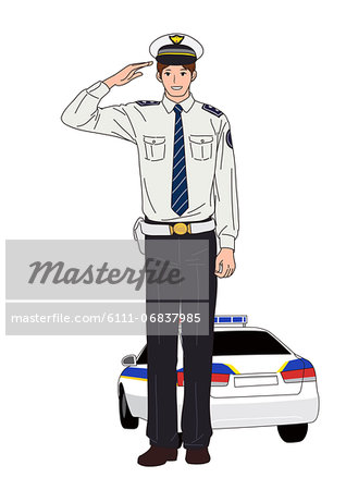 Police officer standing in front of police car.