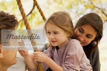 Close up of family on swing