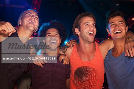 Enthusiastic men at concert