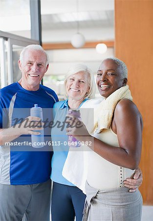 Older people drinking water after workout