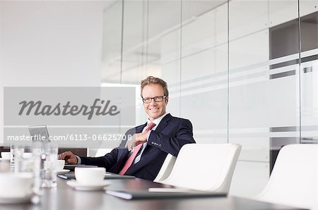 Businessman sitting at meeting table