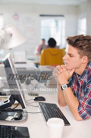 Businessman working at computer at desk