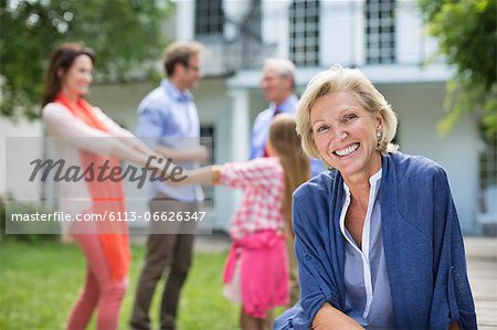 Smiling woman sitting outdoors