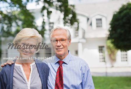 Couple smiling together outside house