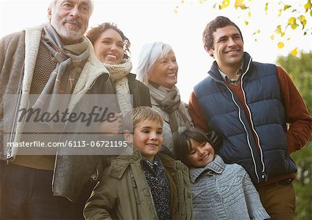 Family smiling together in park Family smiling together in park