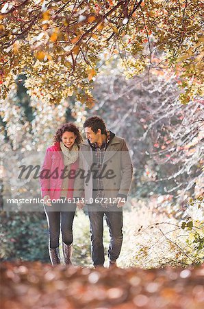 Couple walking together in park