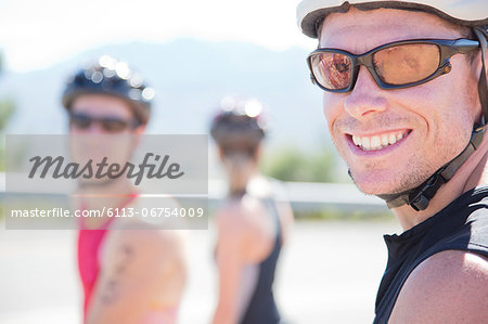 Cyclist smiling on rural road
