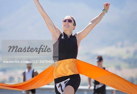 Runner crossing race finish line