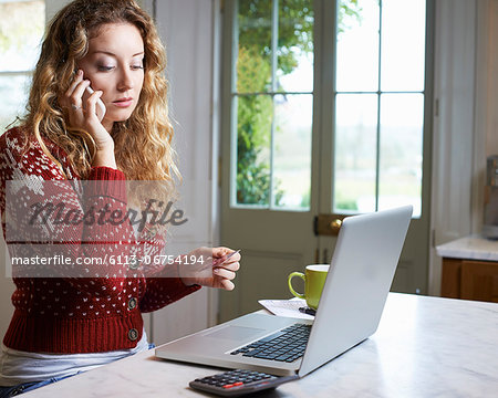 Woman shopping on telephone