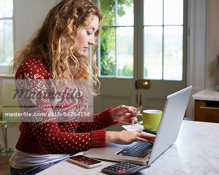 Woman shopping on laptop