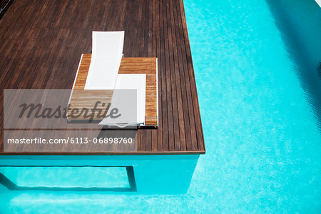 Lounge chairs and swimming pool
