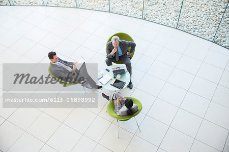 High angle view of business people in meeting High angle view of business people in meeting