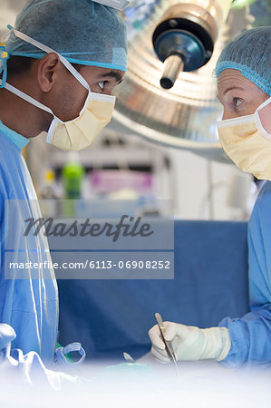 Surgeons talking in operating room