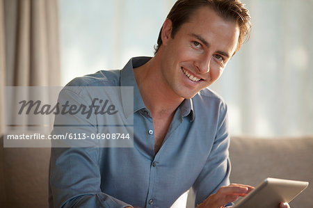 Businessman smiling on sofa