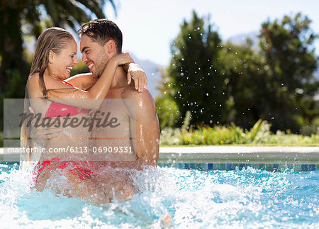 Couple playing in swimming pool