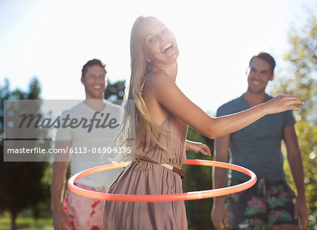 Girl hula hooping outdoors