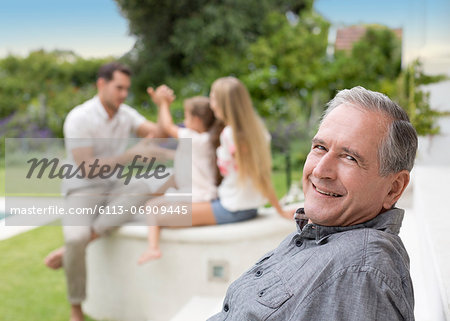 Older man smiling outdoors