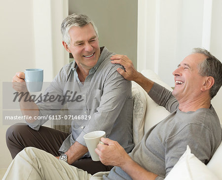 Senior men enjoying cup of coffee