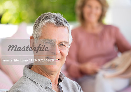 Portrait of smiling senior man on patio